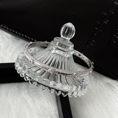 Sterling Silver Rhodium Plated SunStar Zirconia Buccellati Bangle